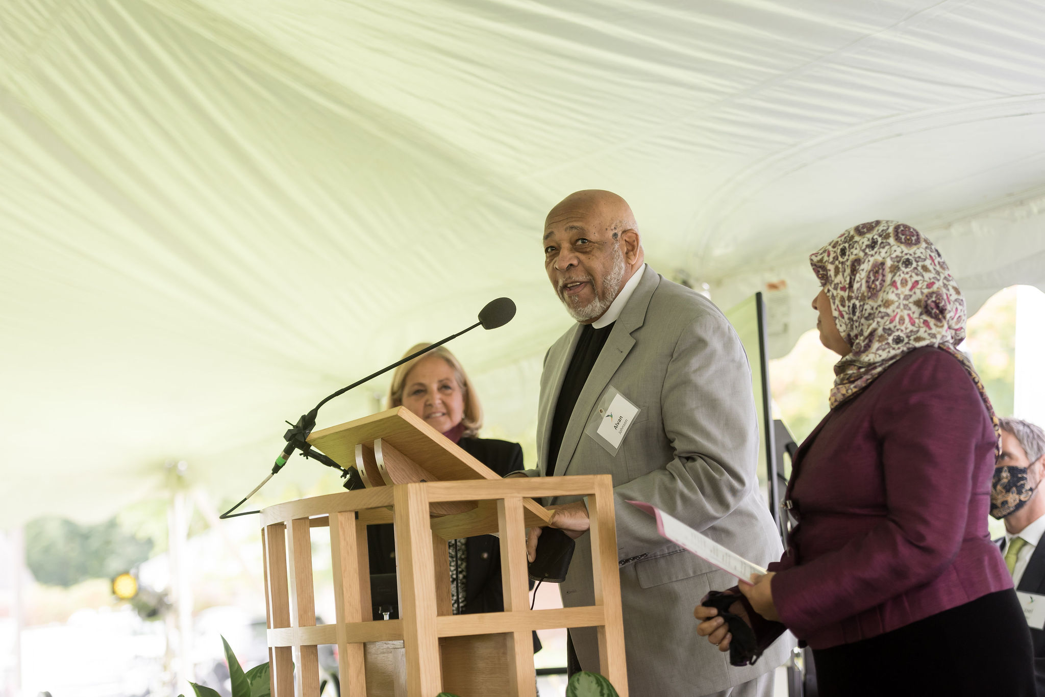 3 speakers at podium for benediction