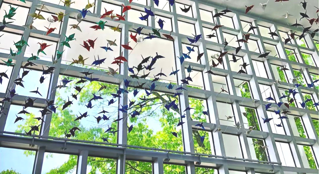 =paper birds hanging in the building