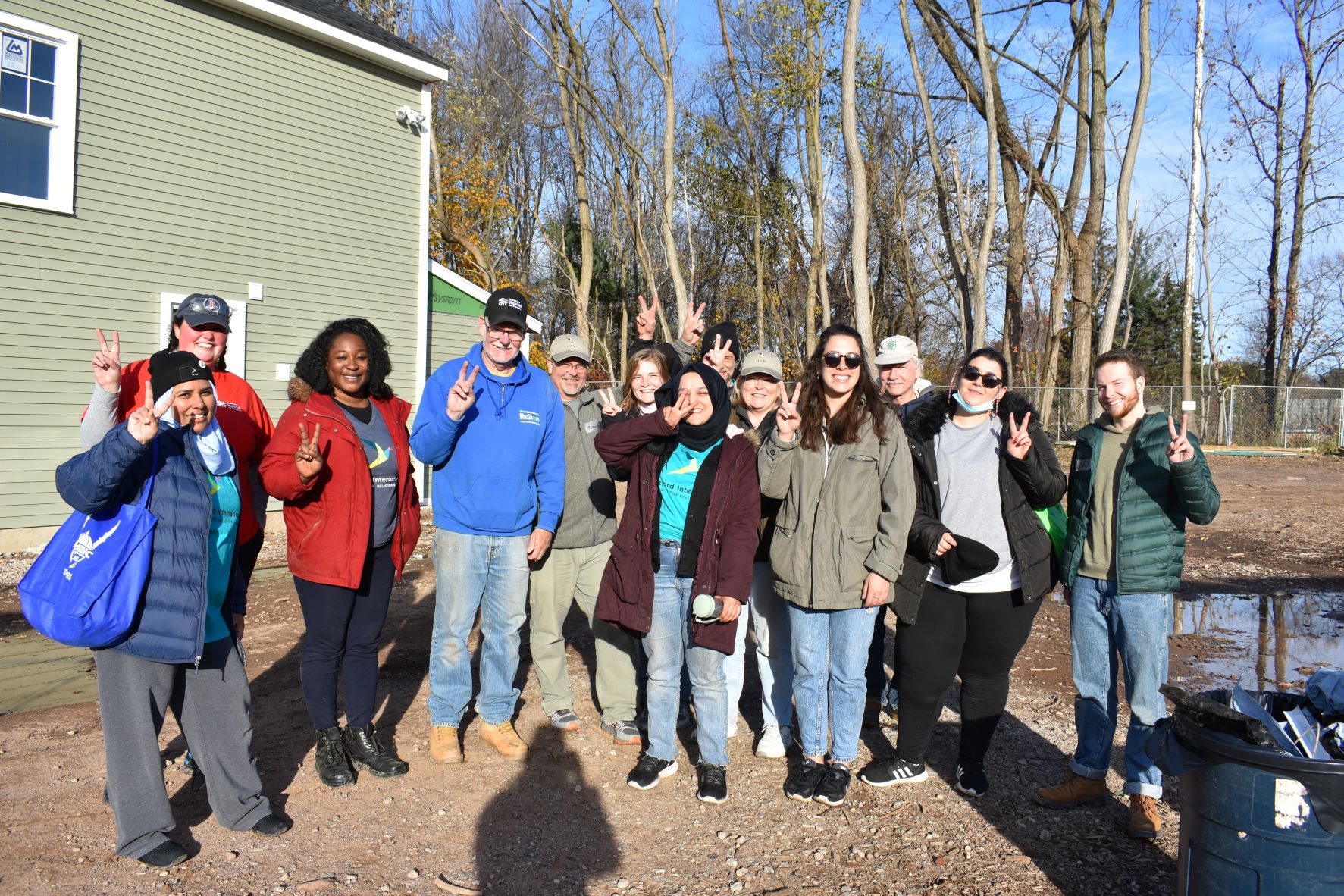 The group giving peace signs