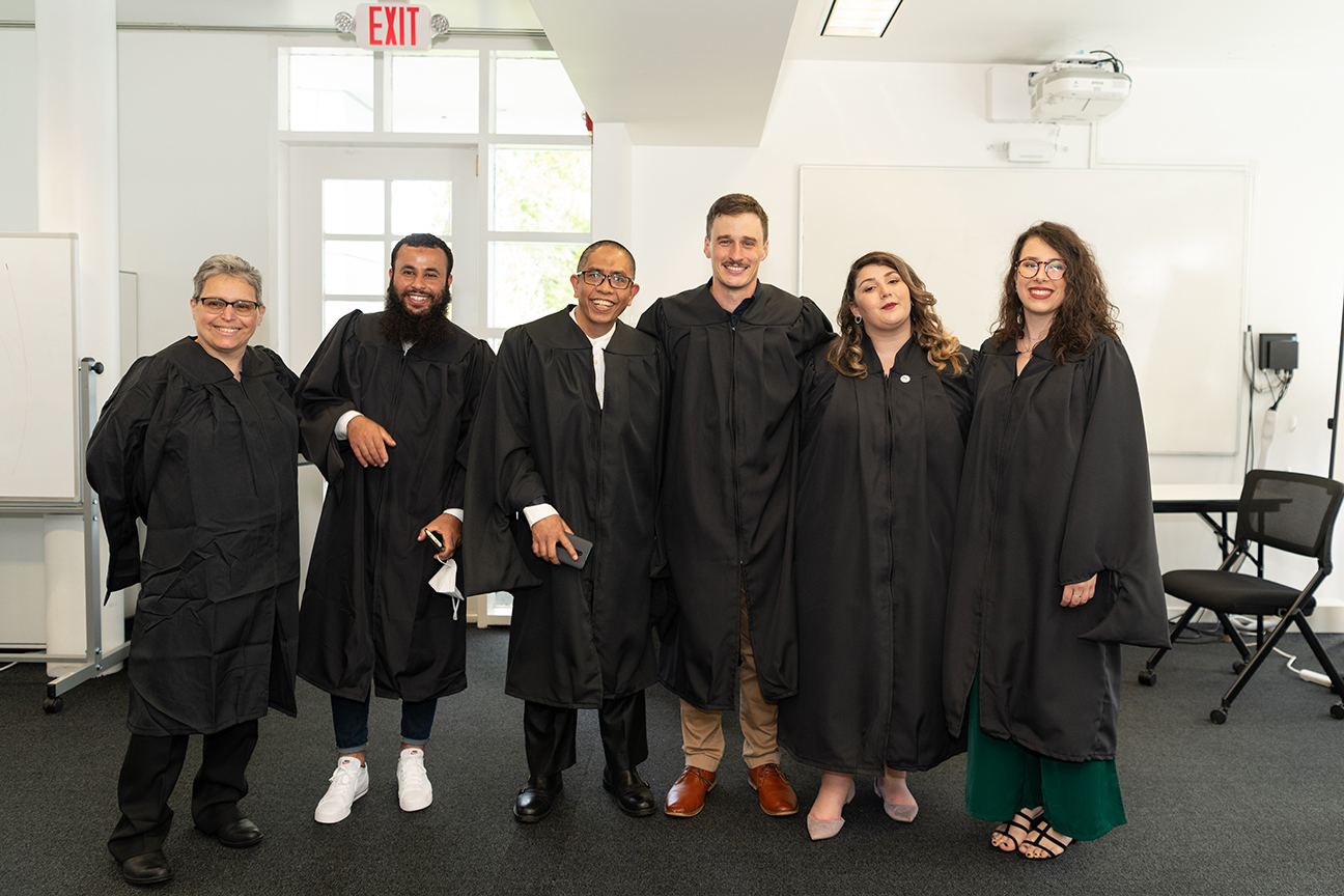 Row of smiling graduates