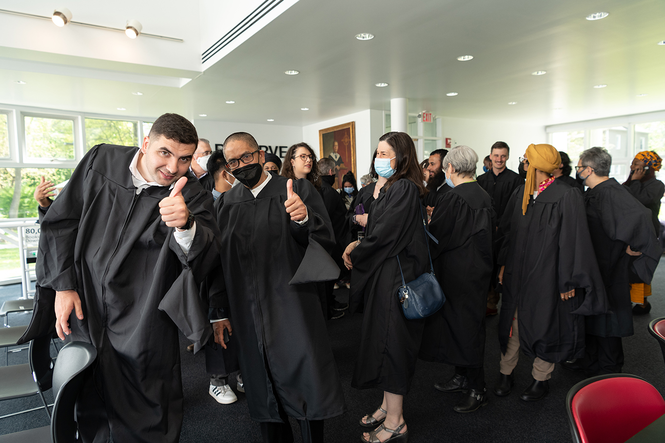 Group of graduates giving thumbs up