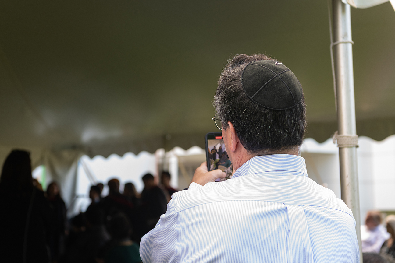 Man in kippah taking pictures