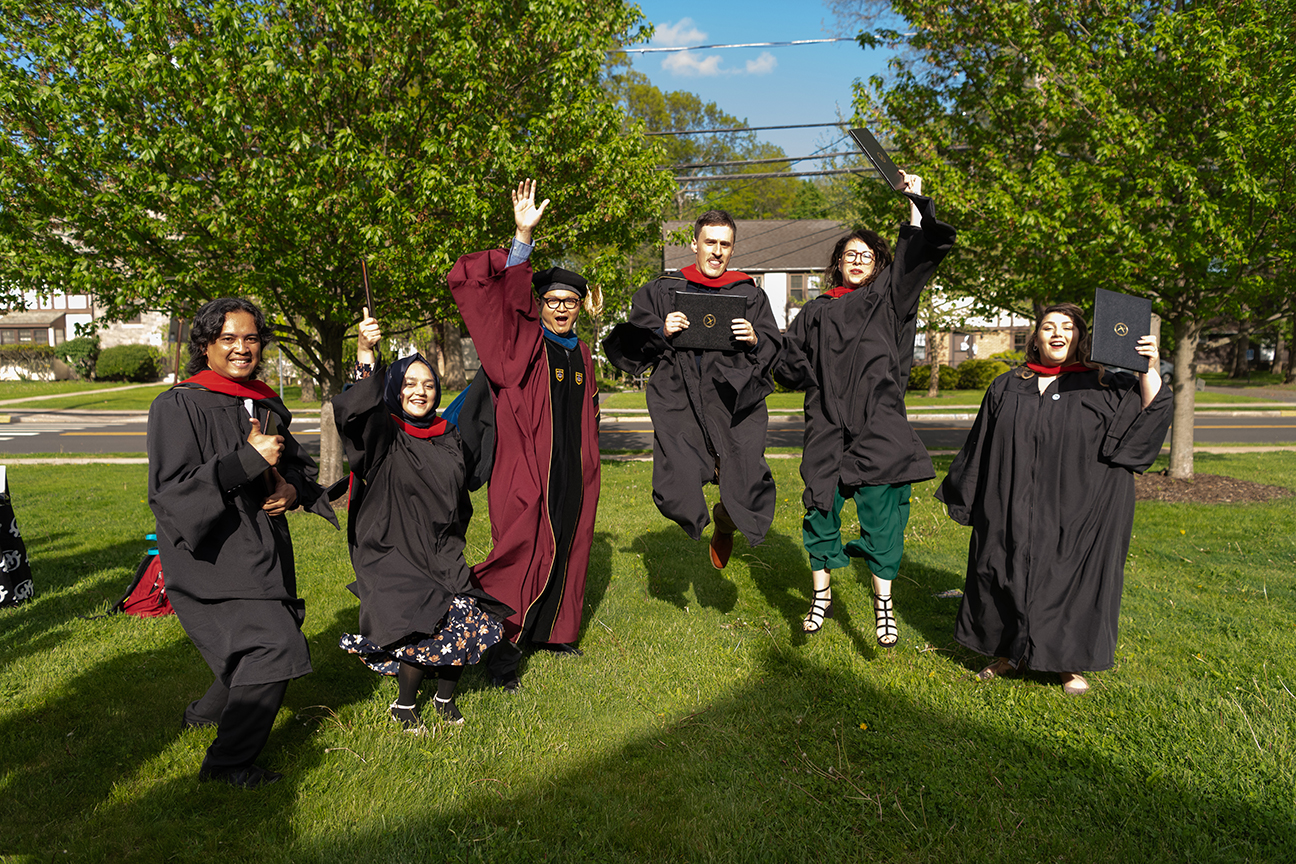 Graduates jumping