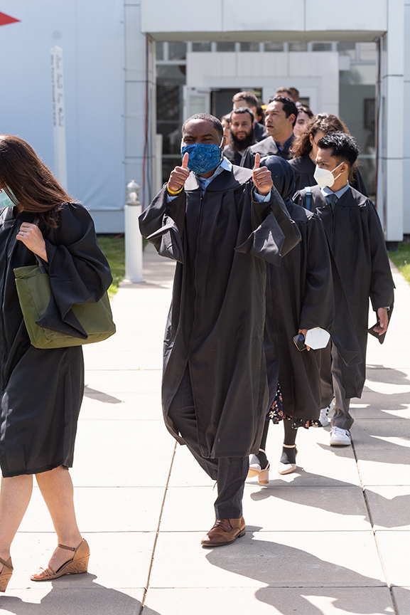 Line of graduates processing