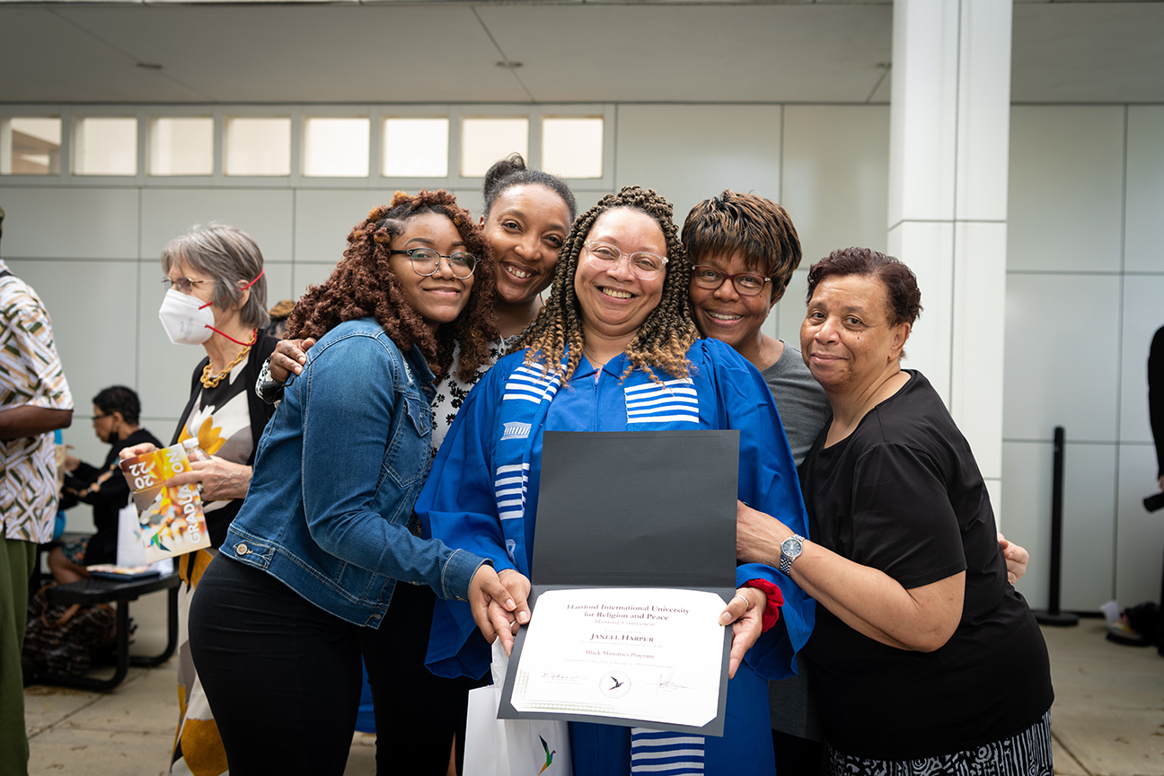 =BMP graduate and friends showing off diploma