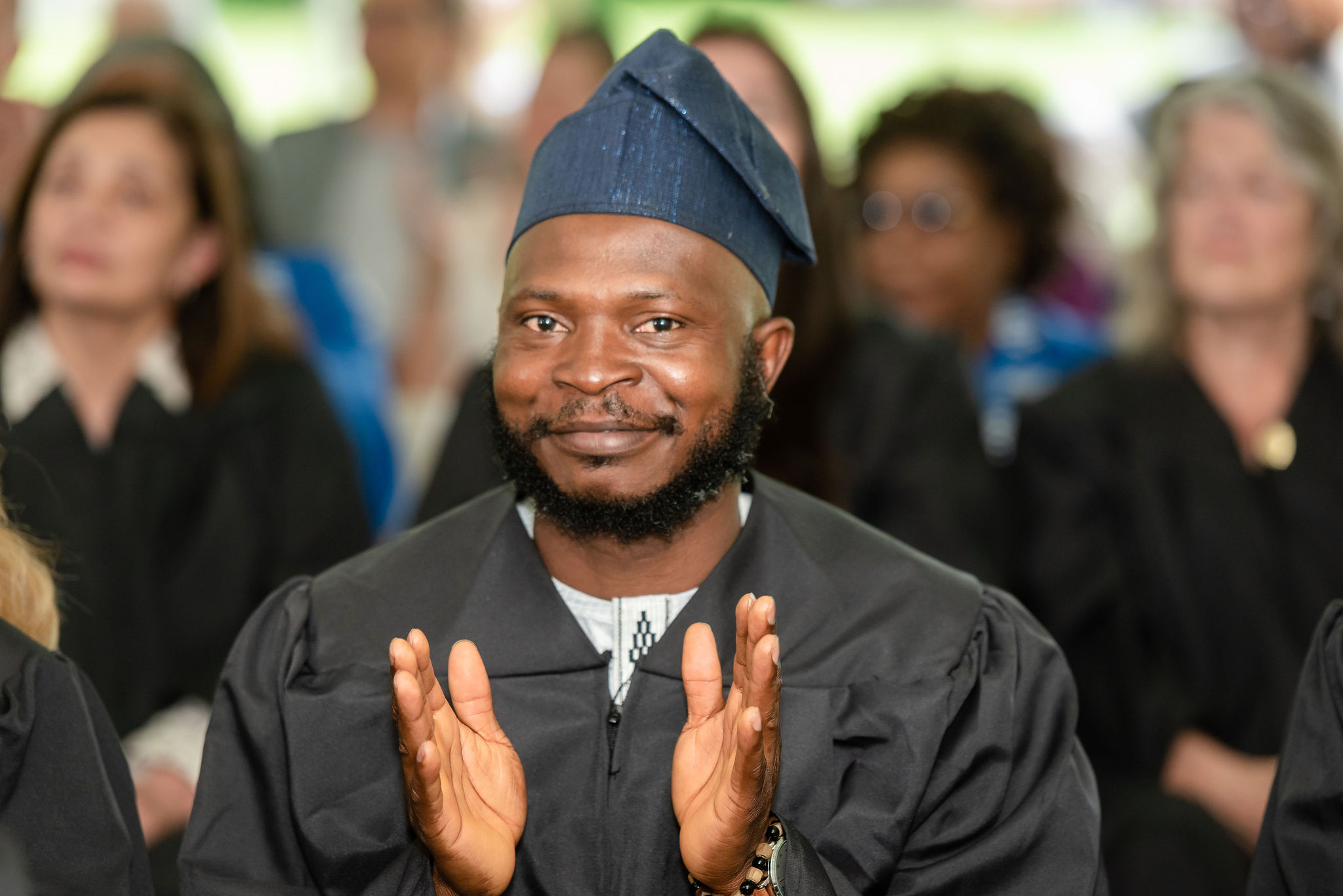 A graduate clapping