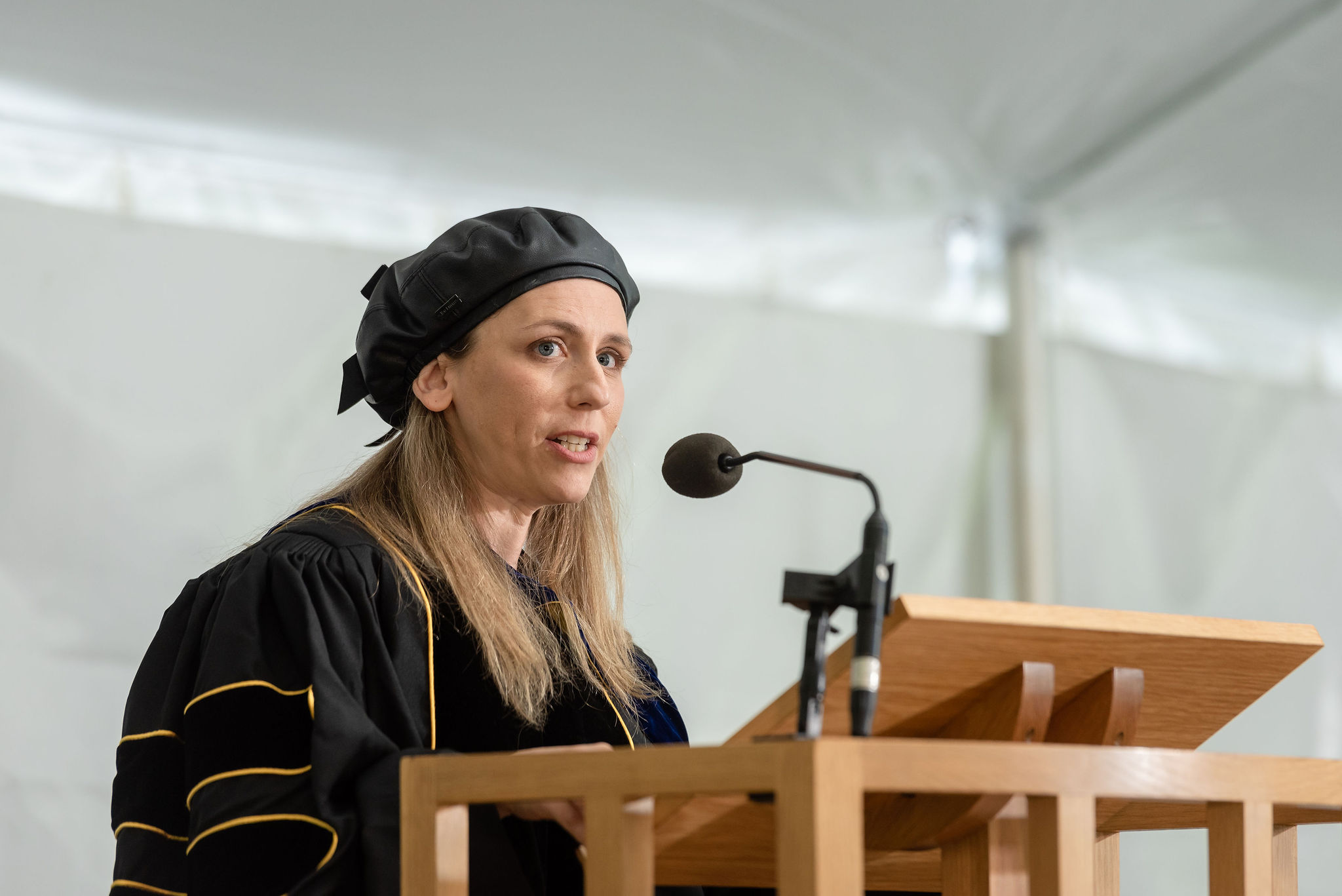 Woman speaking into microphone