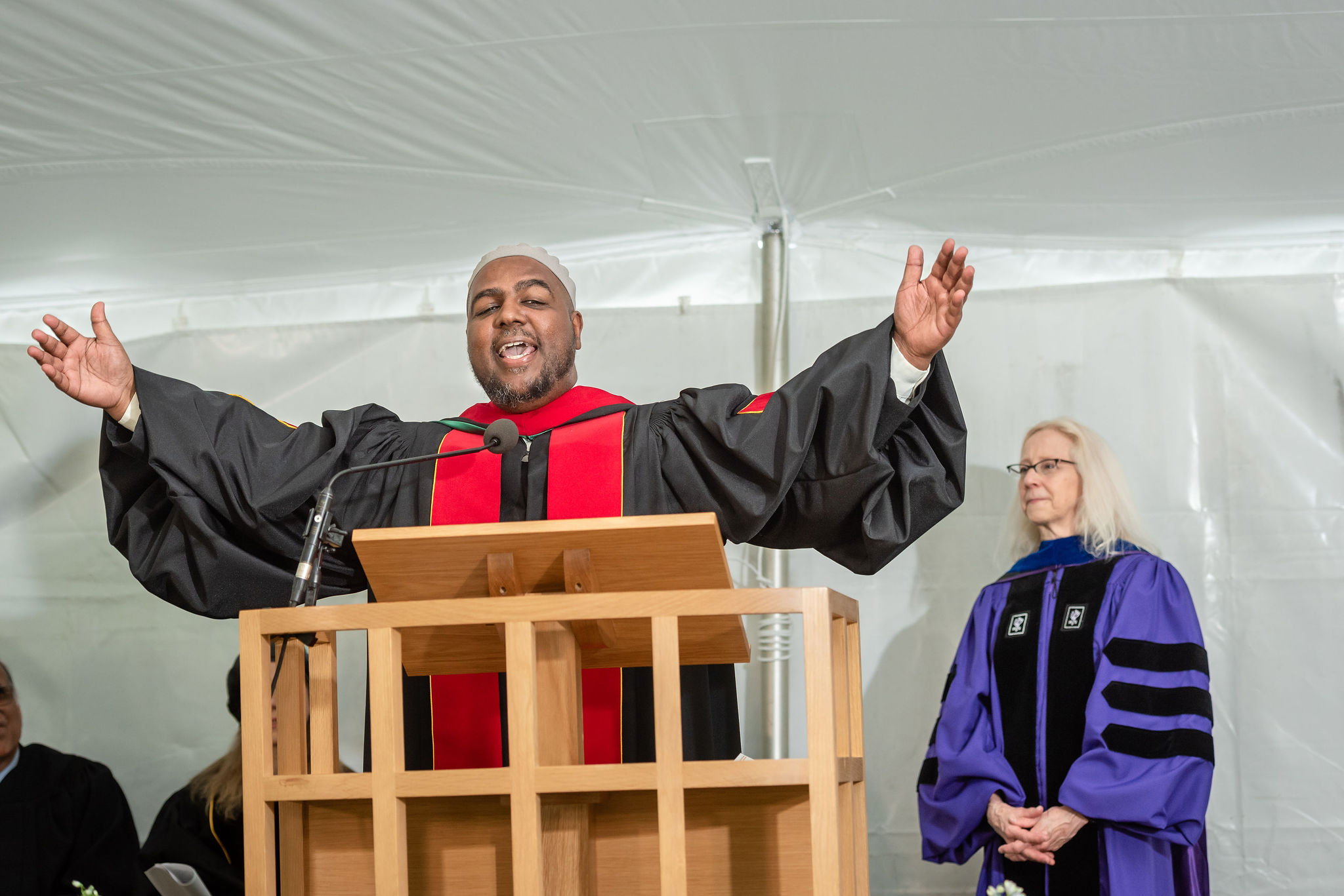 Man preaching at podium