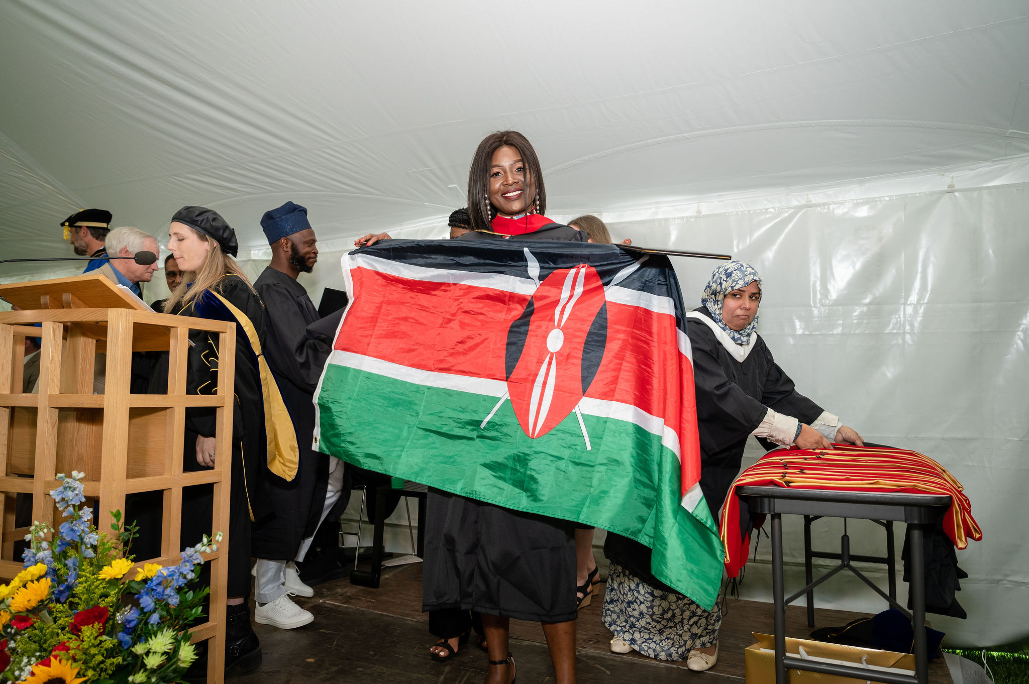 Graduate with flag