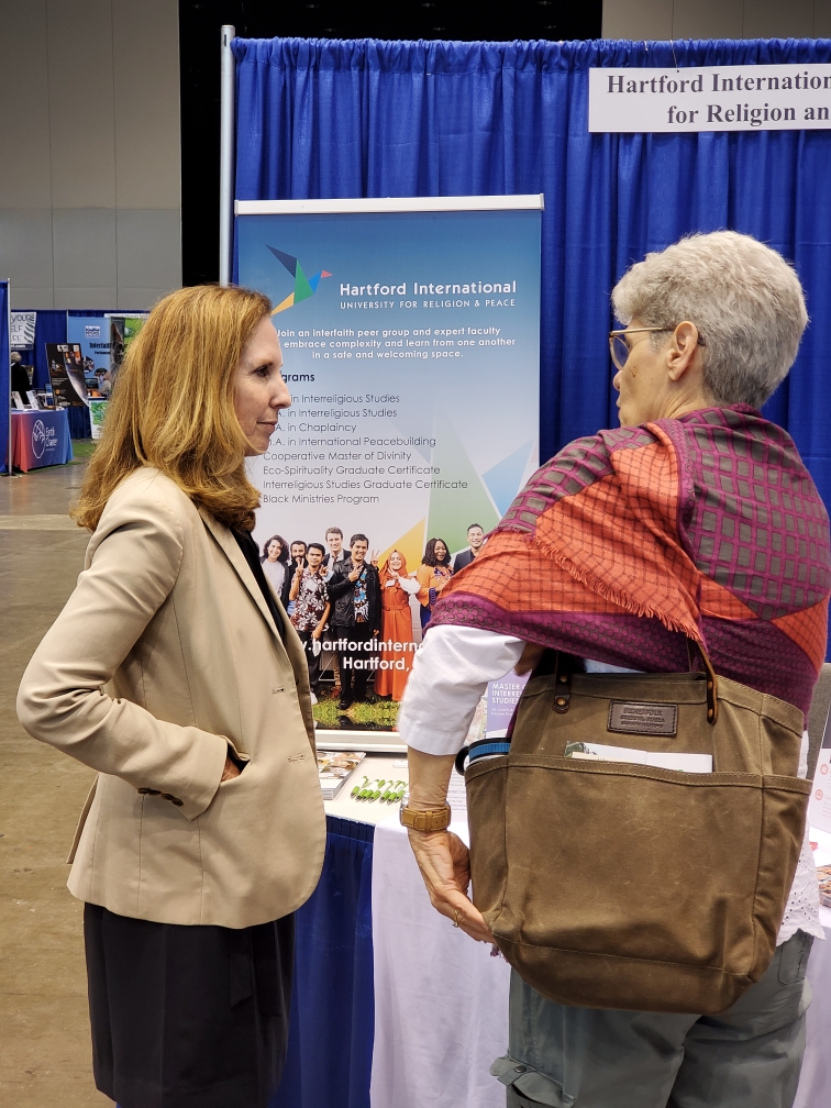 Susan speaking with a woman