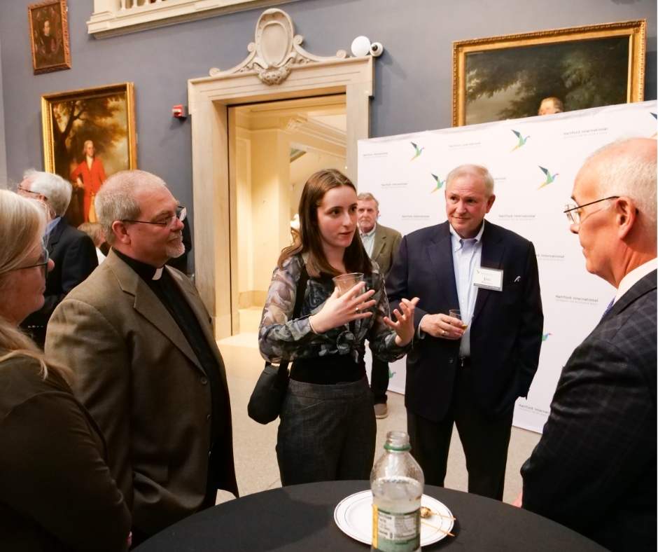 Young woman talking to David Brooks