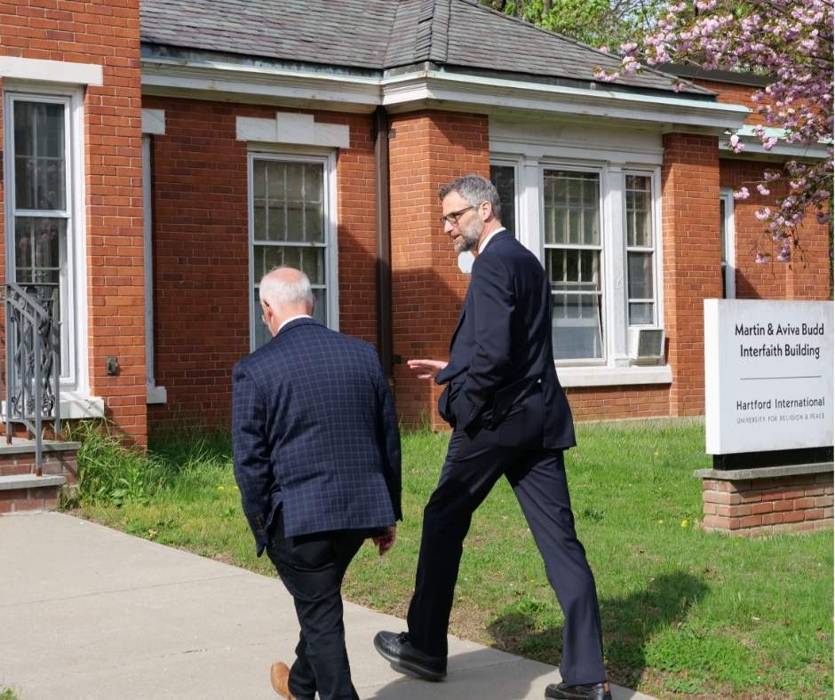 One tall man and one shorter man walking