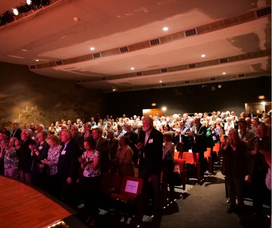 view of audience giving standing ovation