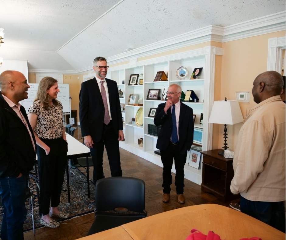 Group of people in a room with books