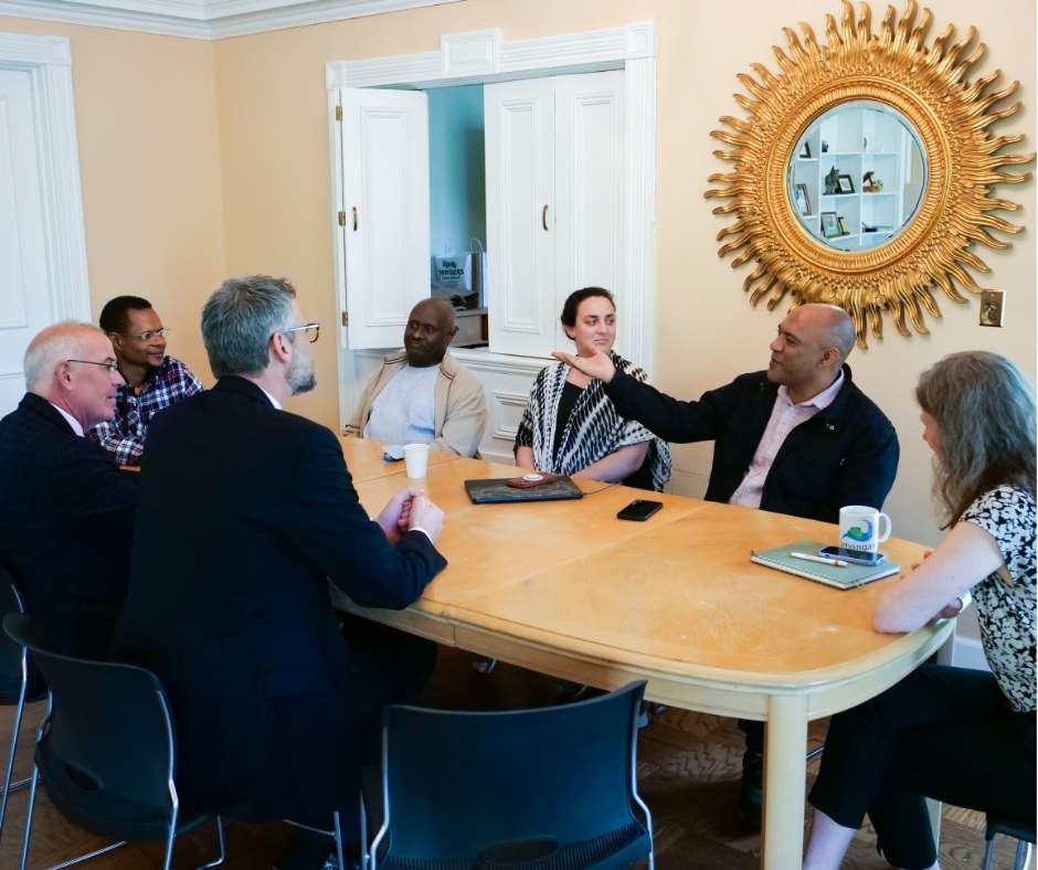 Man gesturing during group conversation
