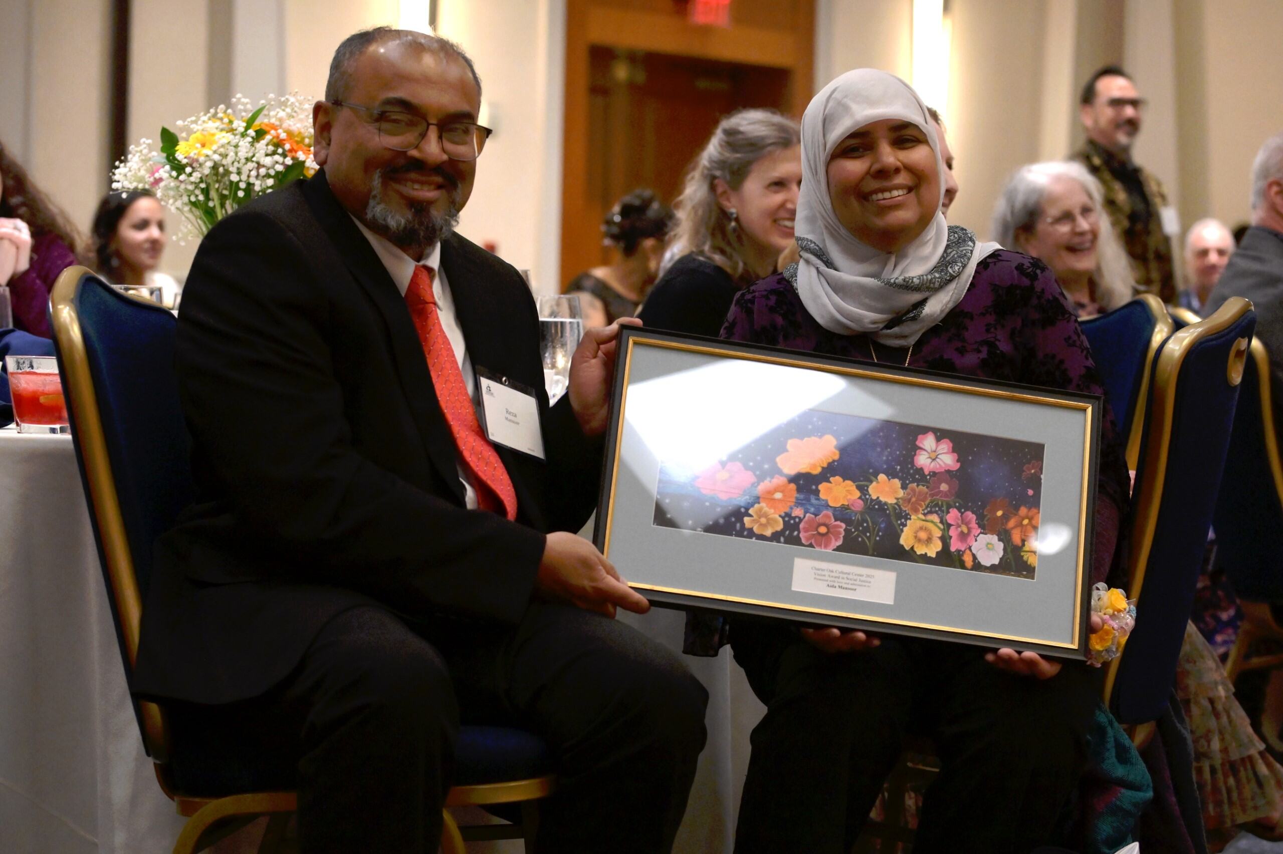 Aida with framed award