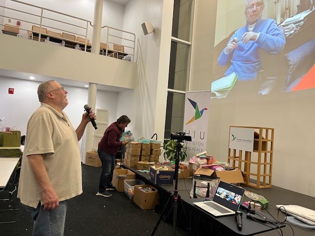 Volunteer speaking to MT