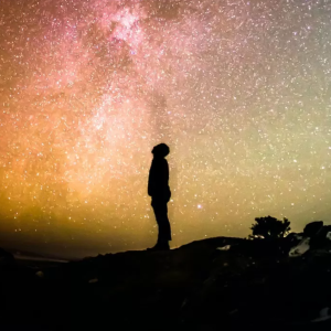 Person looking up at night sky