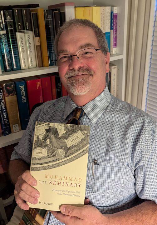 David Grafton holding his book