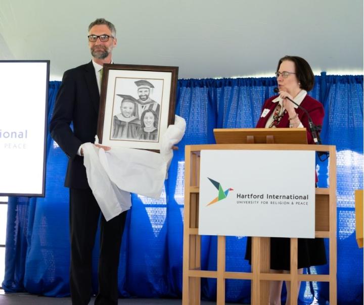 Joel accepting gift of drawing