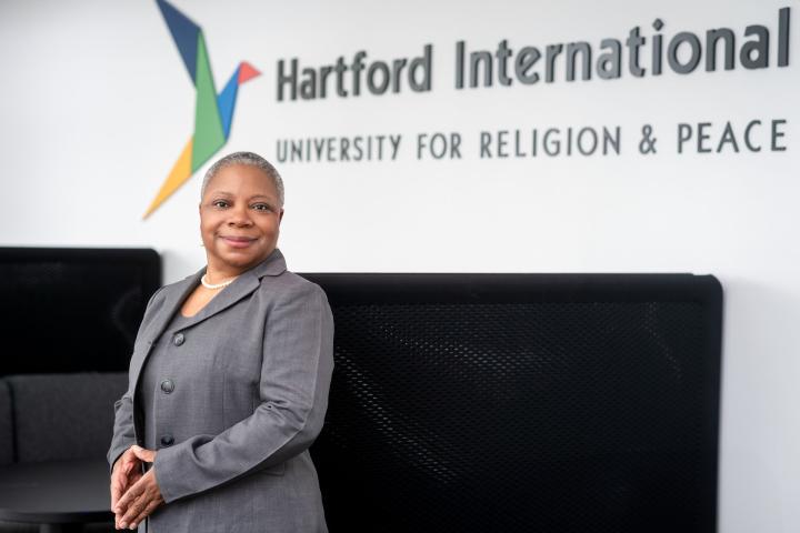 Dr. Sherry Turner in front of lobby sign