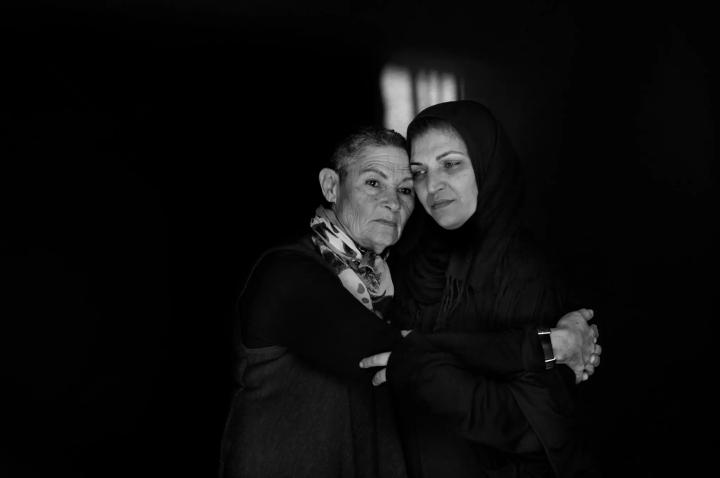 Parents Circle image - two women, one in hijab, hugging