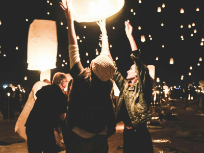 People launching lanterns